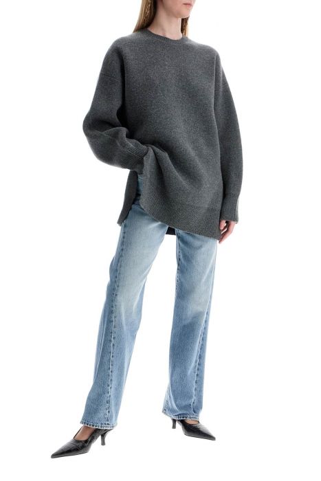 toteme wide leg organic cotton jeans in worn blue with twisted seams