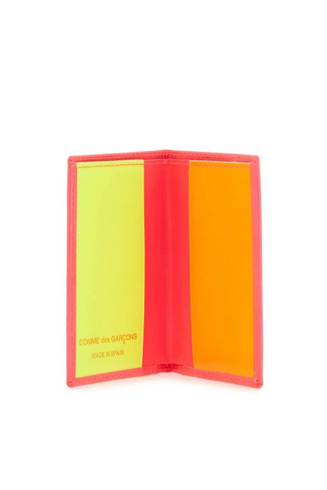 comme des garcons wallet portafoglio compatto unisex rosa fluo in pelle di capra